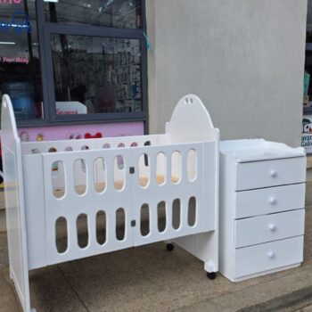 2 x 4 Foldable mdf baby cot with 2 x 3 Ft chest of drawers.